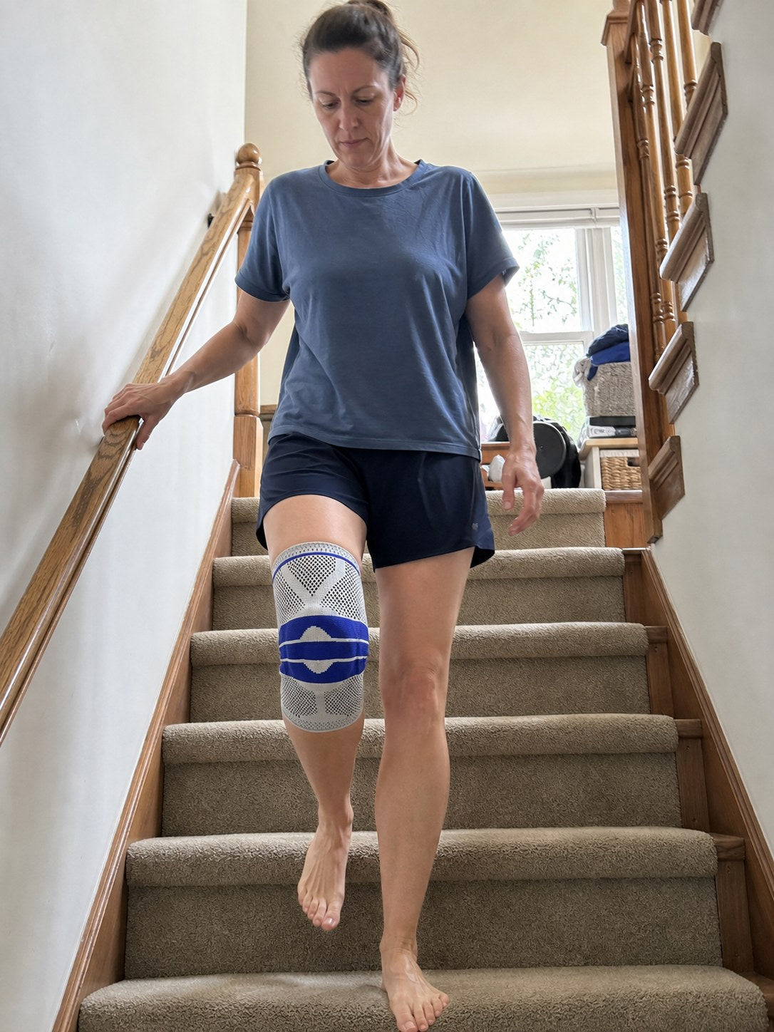 Wearing the AlignaFit knee sleeve on the stairs