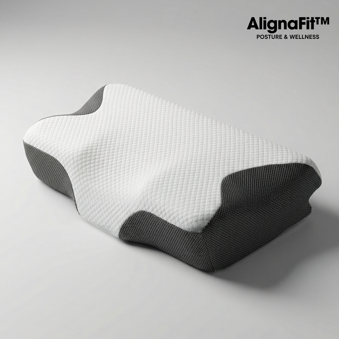 AlignaFit Orthopedic Neck Pillow on bed showing dual-zone shape for side and back sleepers