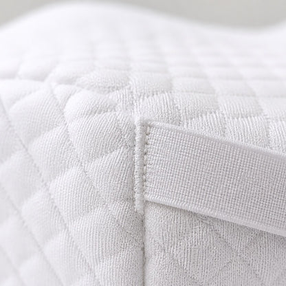 Close-up of the white AlignaFit knee pillow quilted knit fabric and strap stitching