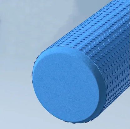 Blue AlignaFit foam roller with textured surface on a light gray background