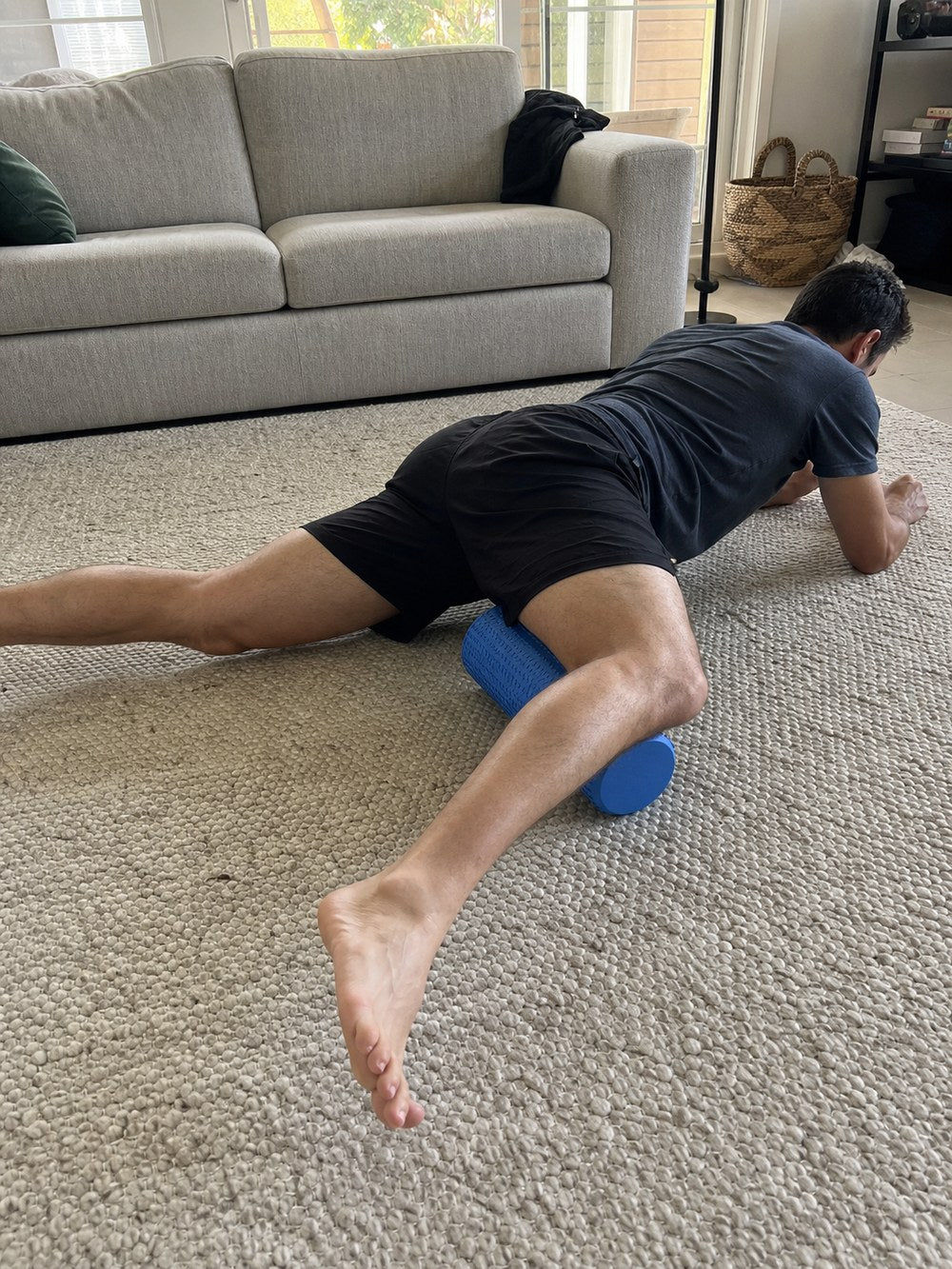 Rolling the quads with the AlignaFit foam roller at home