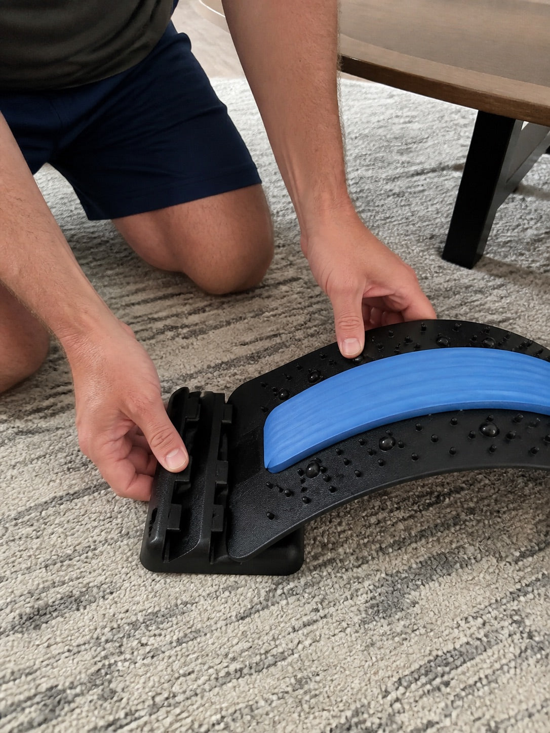 Clicking the AlignaFit back stretcher into its arch level